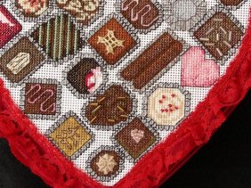 Cross stitch chocolate candies in heart box 3D